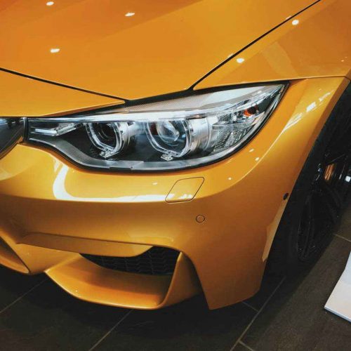 Foto BMW M naranja sin editar necesita protegerse y mejorar el brillo en la pintura del coche darcerapulircera.com